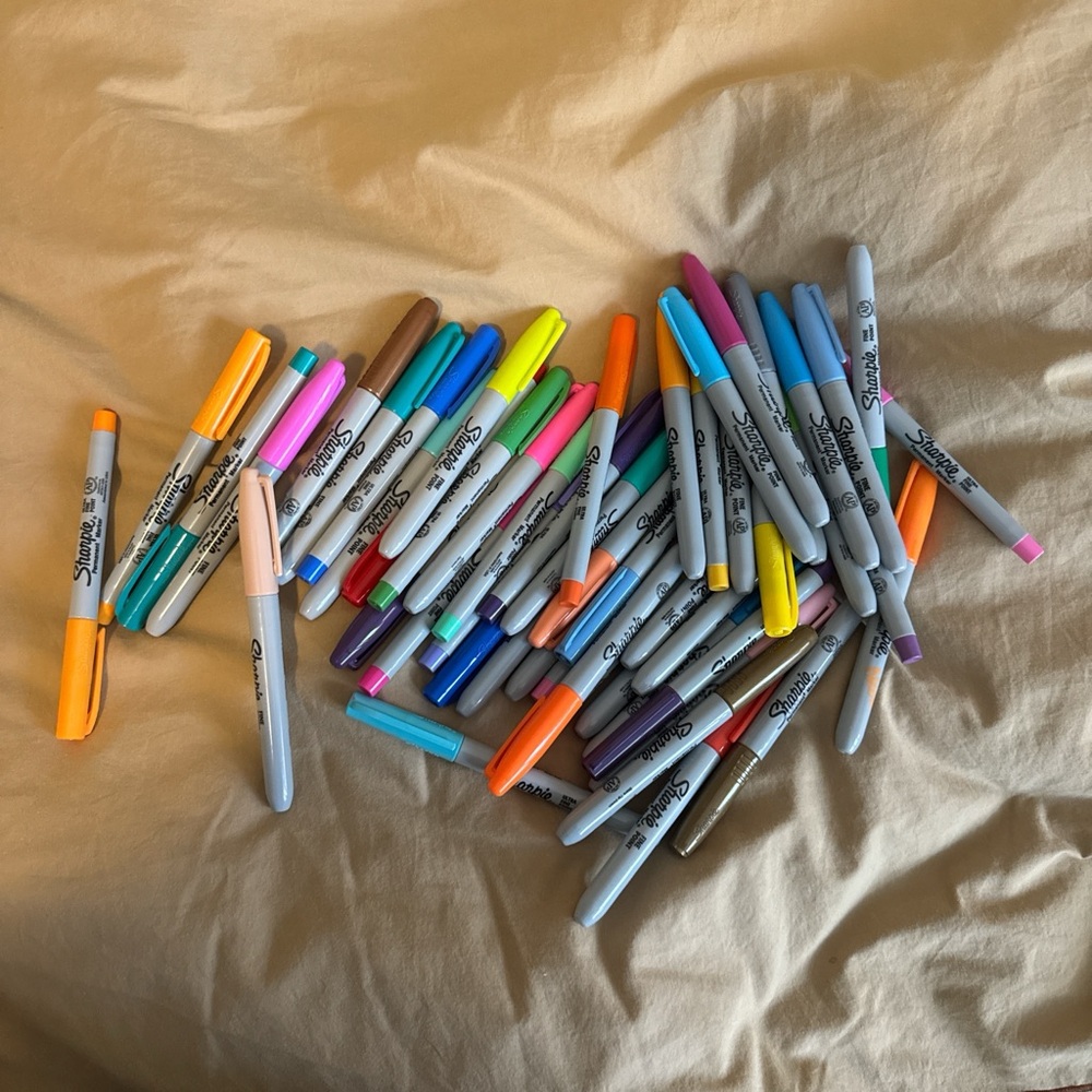 assorted colorful sharpie markers working with ink
